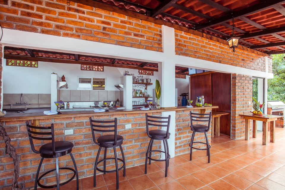 bar with stools and drinks at a resort in yelapa
