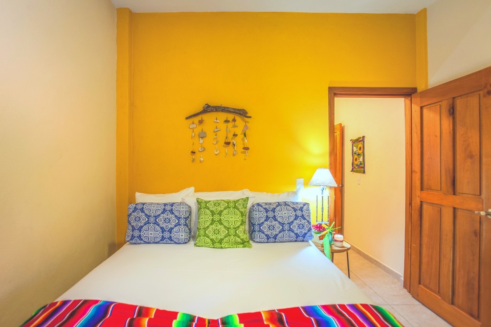 colorful bed in the master bedroom at miramar yelapa