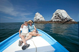 couple relaxing on the boat to marietas islands
