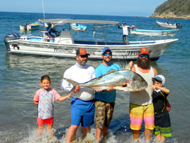 family going sports fishing in yelapa, mexico