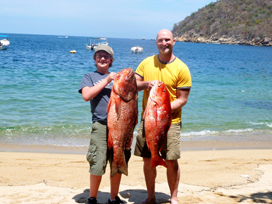 friends pose with large fish they caught at miramar yelapa