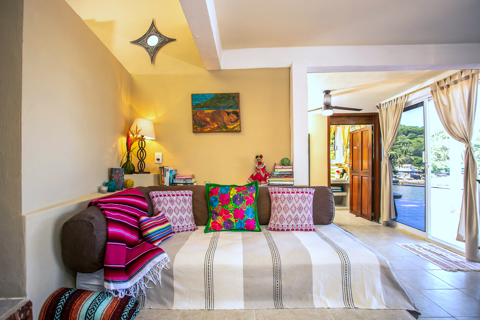 cozy, colorful bed at casa manta ray