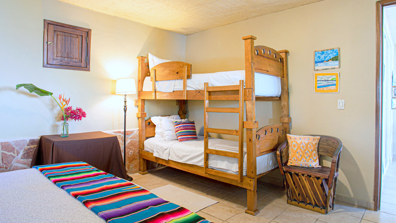casa palmita with a queen bed and set of bunk beds